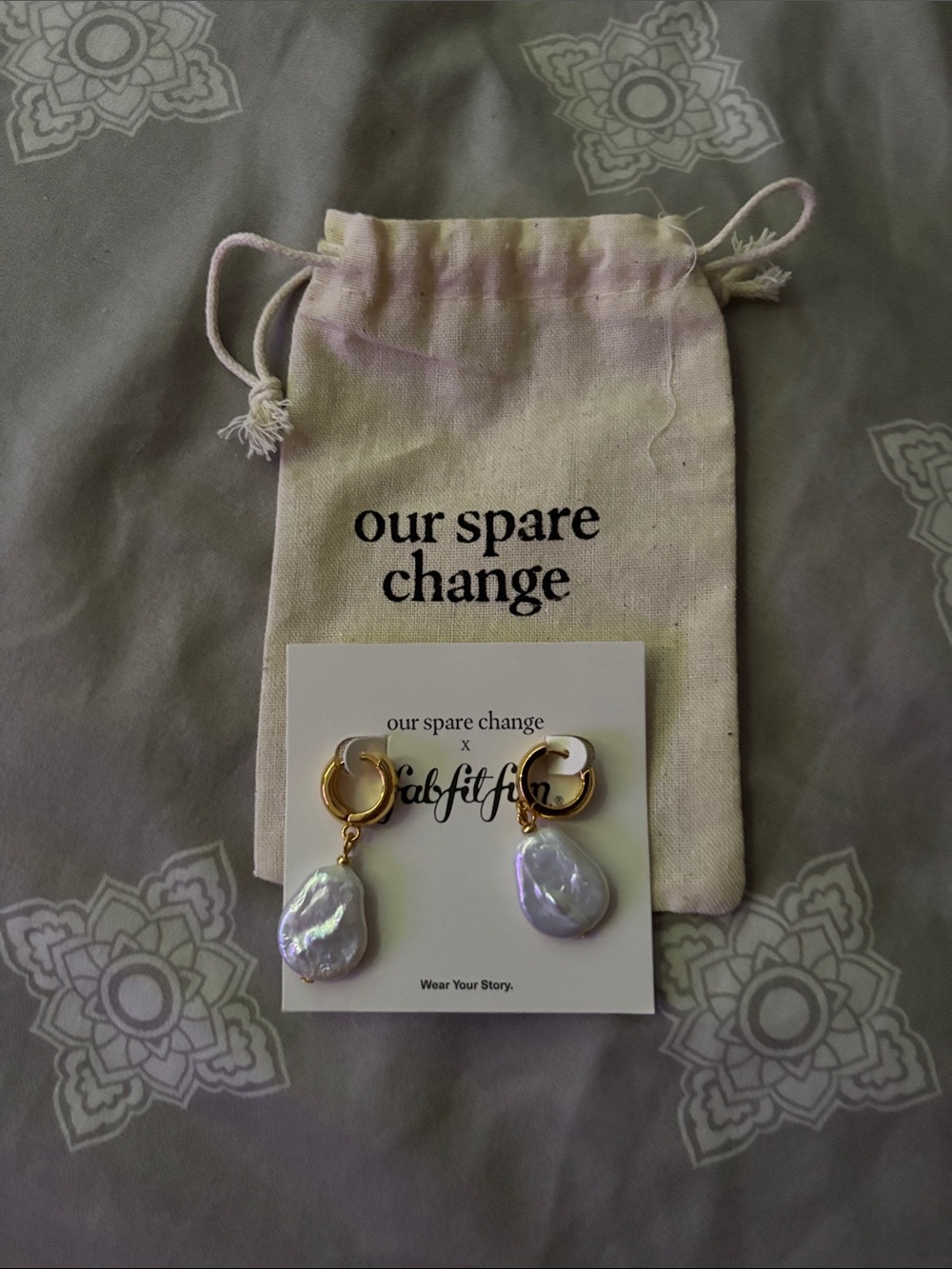 our spare change Isla Gold Hoop Earrings with Iridescent Pearl Drops